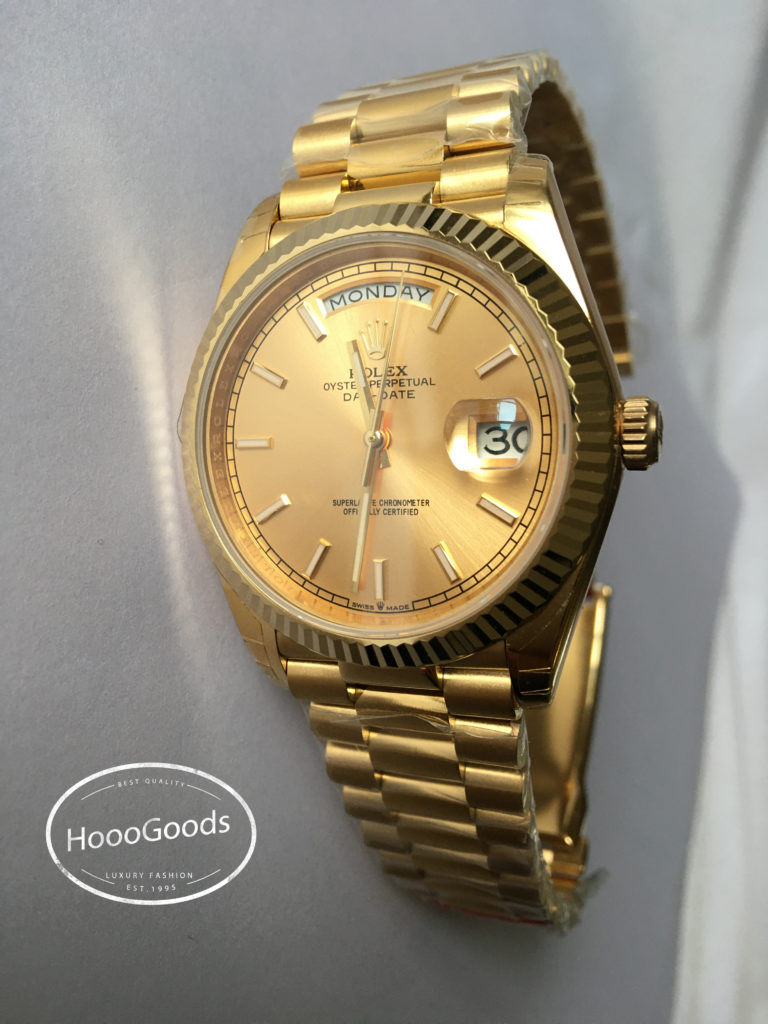 Classic Rolex Watch Oyster Perpetual Day-Date 40 in yellow gold with a champagne-colour dial, Fluted bezel and a President bracelet