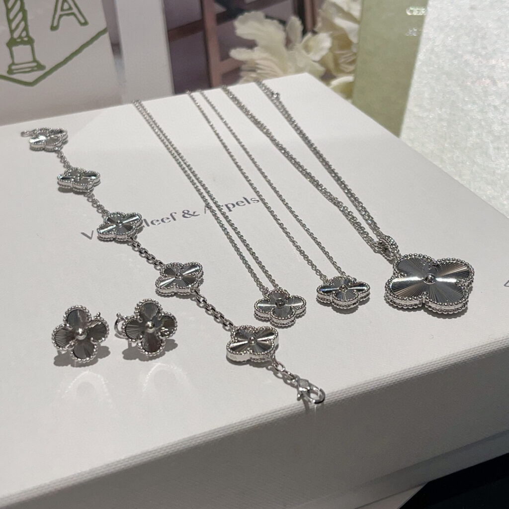 Van Cleef Guilloche white gold Collection: Vintage Alhambra Bracelet, Pendant, earrings and 20 motifs long necklace