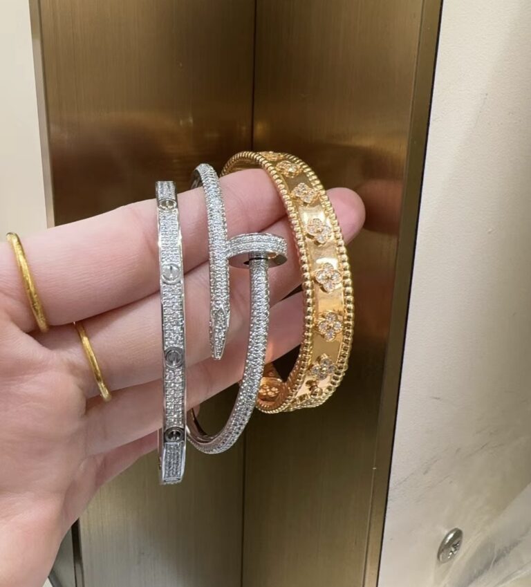 Stackable Bracelets: Rose Gold VCA Perlée clovers bracelet, white gold Full Pave Diamond Cartier small love bracelet and Juste Un Clou Bracelet